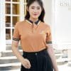 Đồng phục công ty màu vàng đồng - TT108, nữ đứng thẳng dưới mái vòm